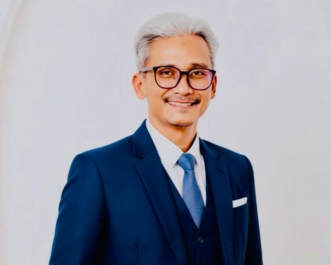 Ketua Ikatan Sarjana Ekonomi Indonesia (ISEI) Cabang Batam yang juga Dosen Universitas Internasional Batam, Dr. Suyono Saputra